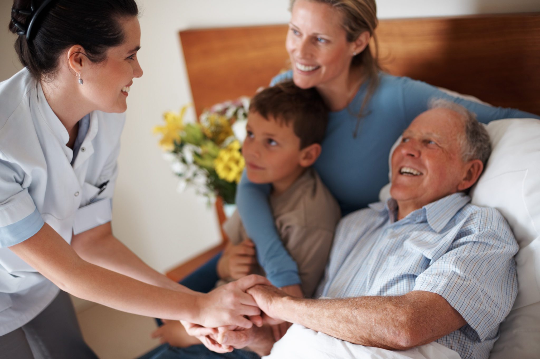 Doctor shaking hands with a recovered elderly man