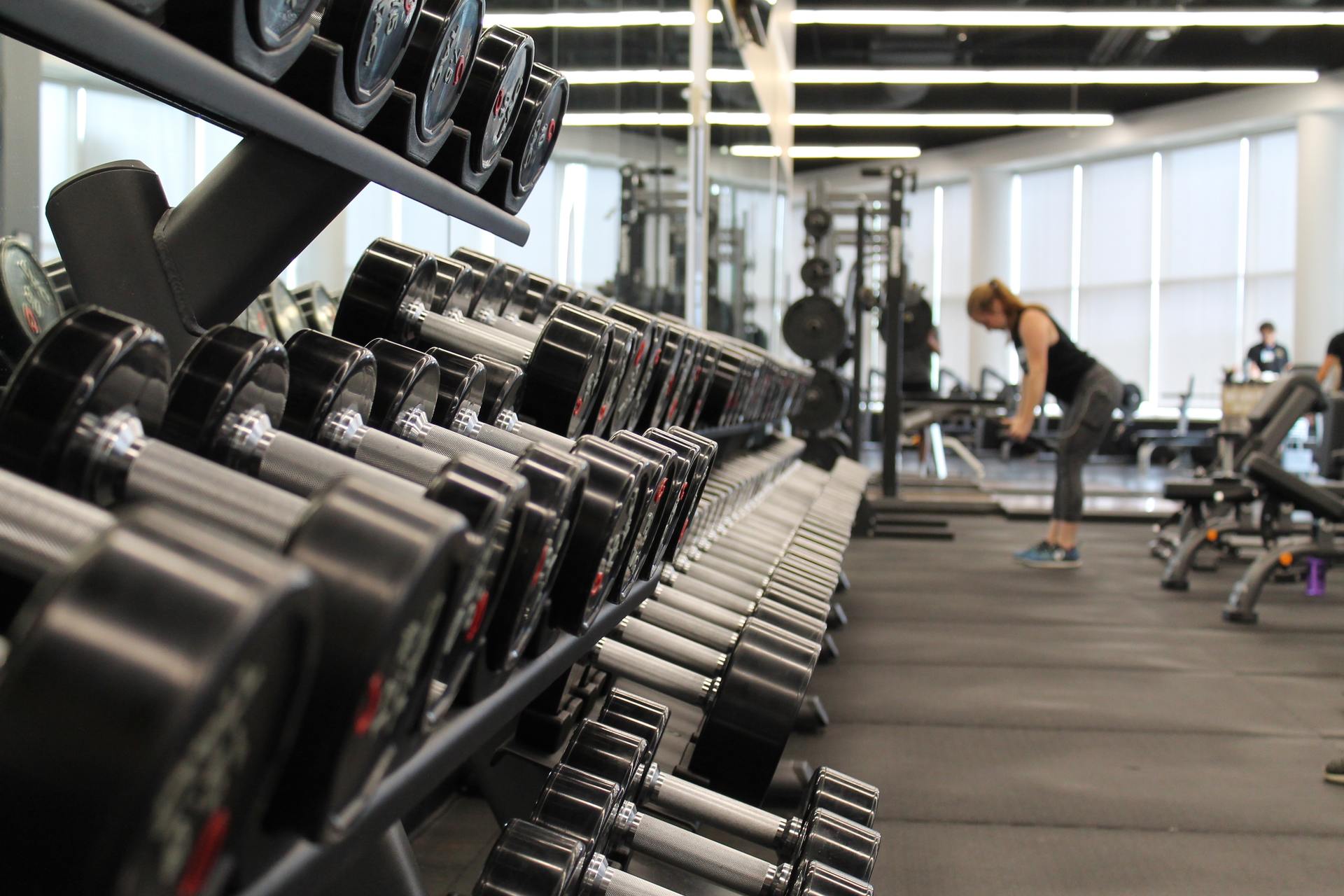 A nice gym equipment with an attractive woman on a background